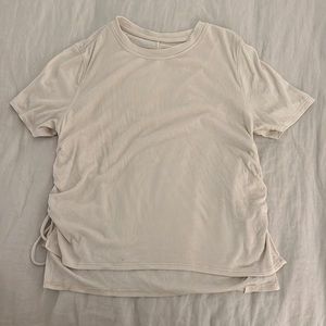 White lululemon ribbed shirt, cinched sides. Size 10 very soft, barely worn